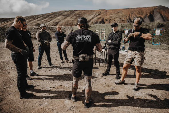 Shooters gathered for a training session at an outdoor range